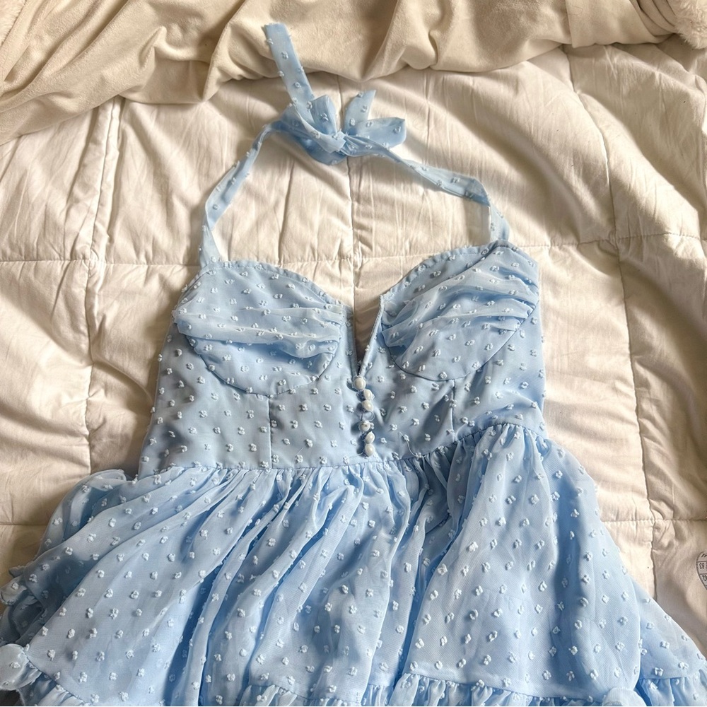 Blue dot babydoll mini dress with ruffles and low V neckline